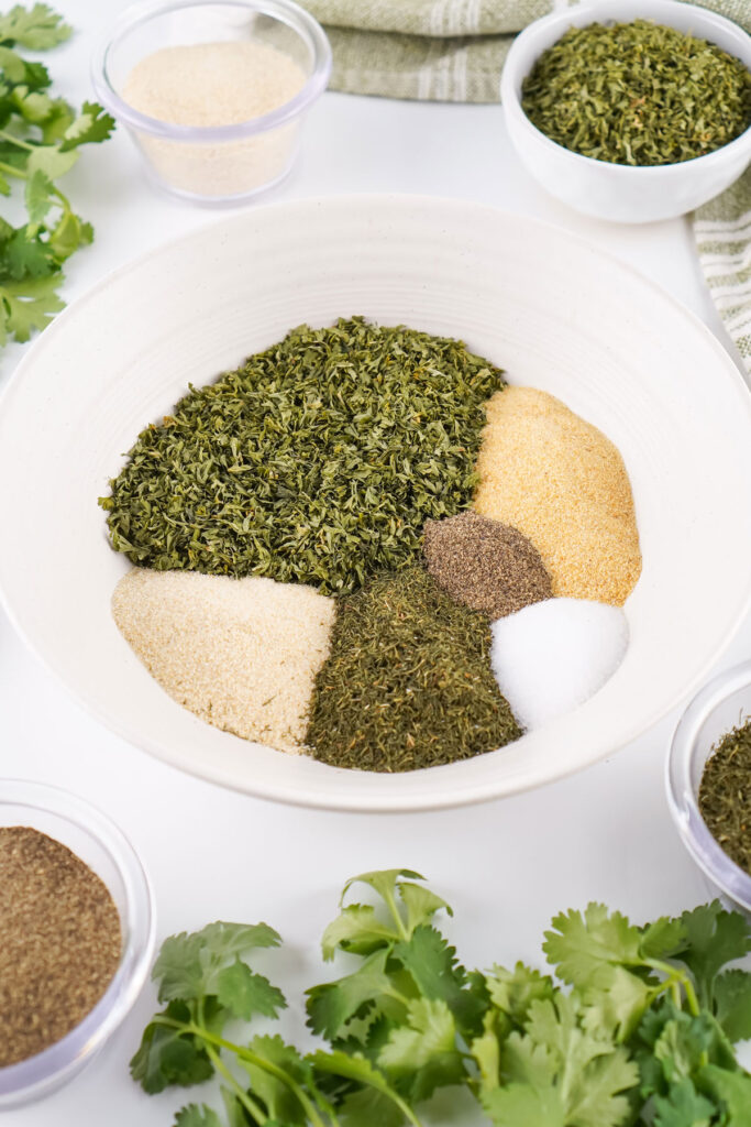 homemade ranch seasoning ingredients in white bowl before mixing