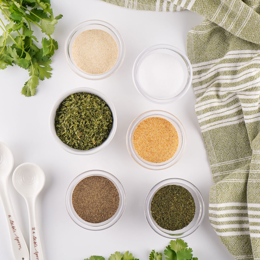 homemade ranch seasoning ingredients in bowls on countertop