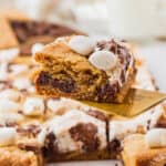 s'mores cookie bars piece on spatula
