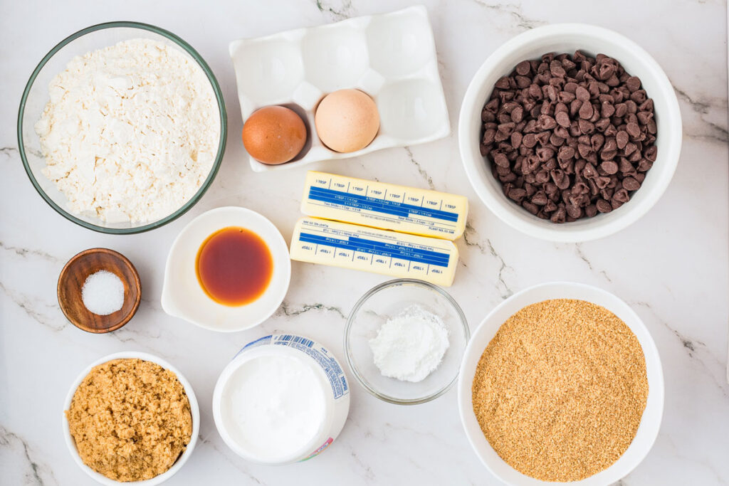 s'mores cookie bars ingredients in bowls on countertop