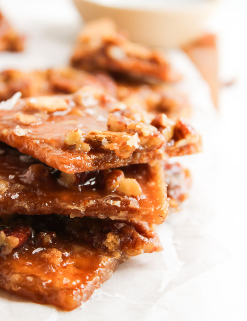pecan pie bark pieces on parchment paper