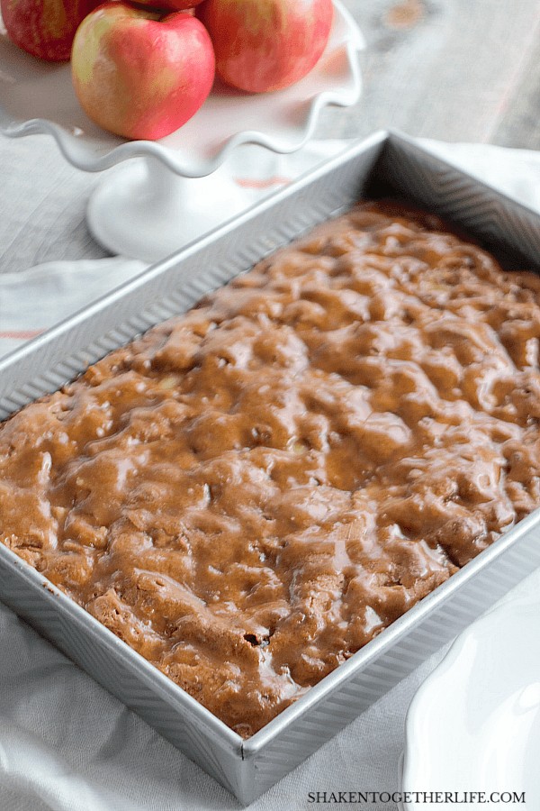 cinnamon apple cake with cinnamon glaze in baking dish