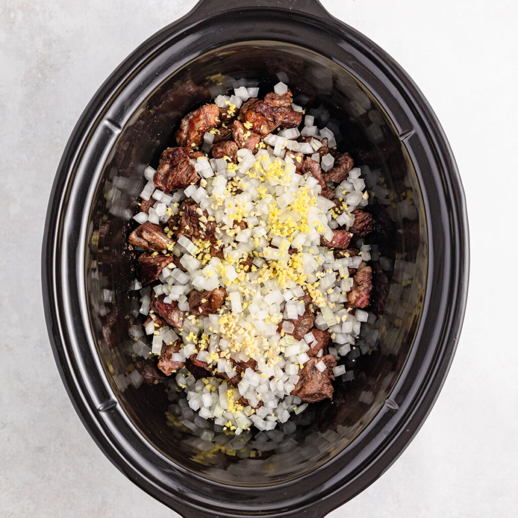 slow cooker beef curry ingredients in crock pot