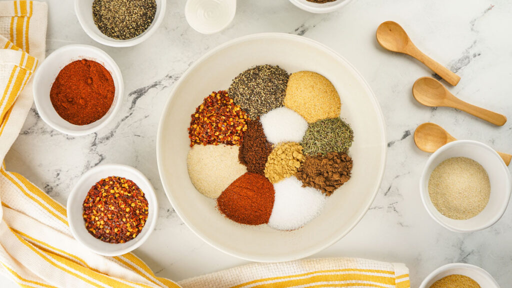 Jamaican jerk seasoning ingredients in bowl before mixing together