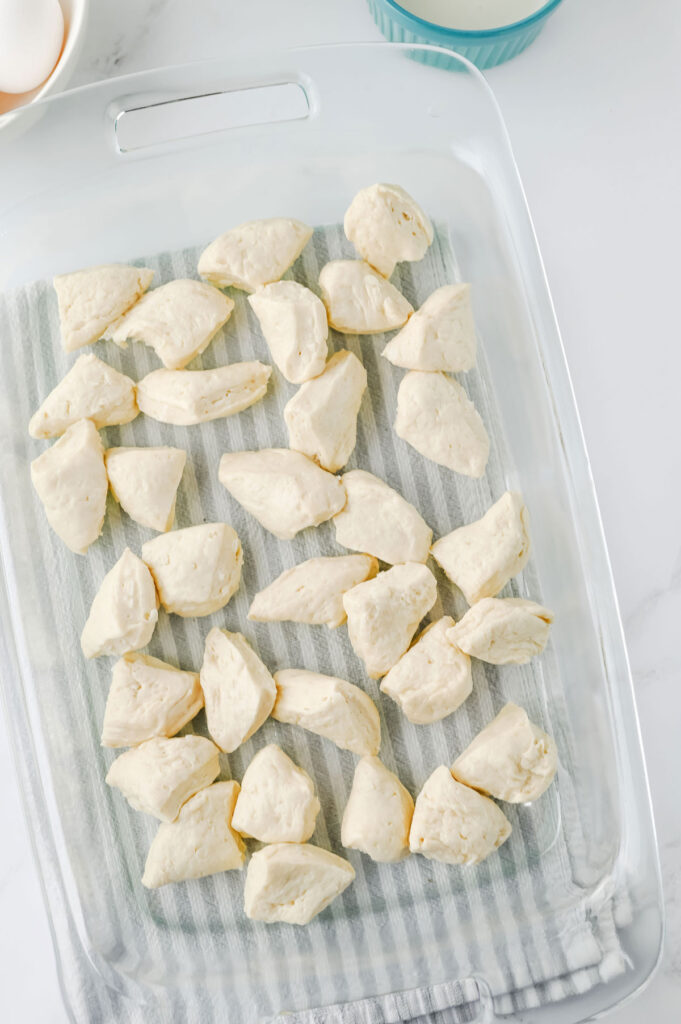 biscuit dough pieces in casserole dish