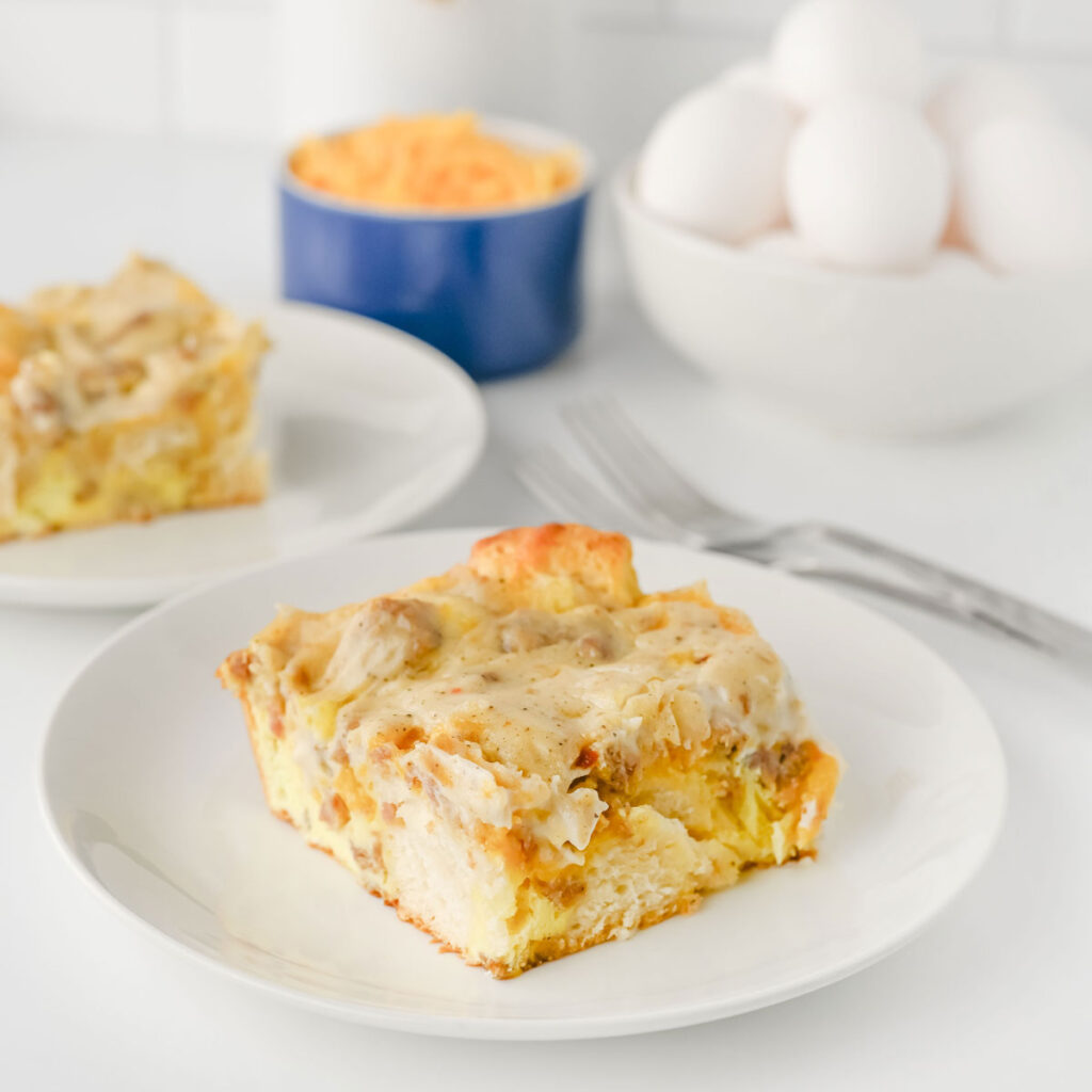 slice of biscuits and gravy casserole on white plate