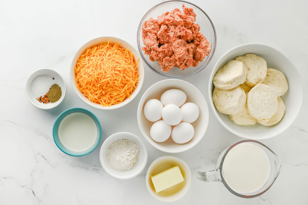 biscuits and gravy casserole ingredients in bowls on counter
