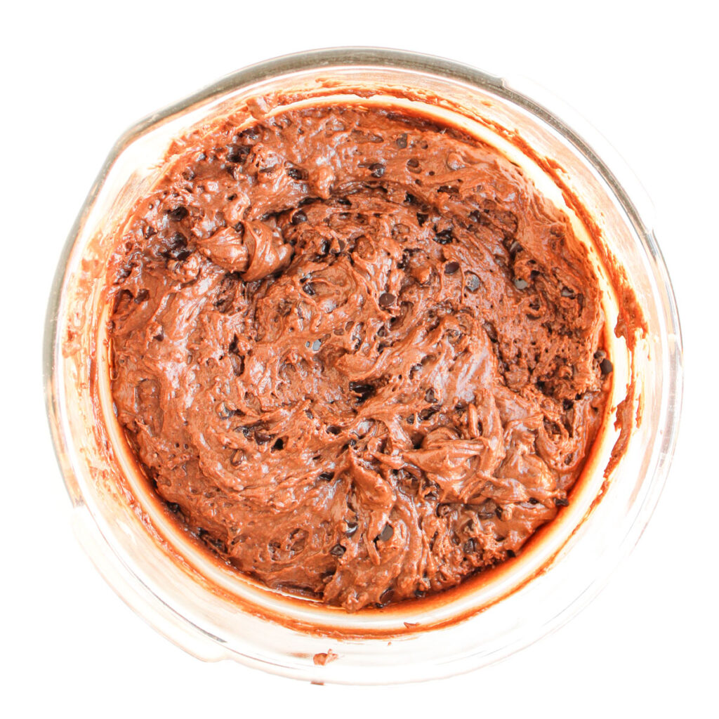 chocolate muffin batter with chocolate chips in large bowl