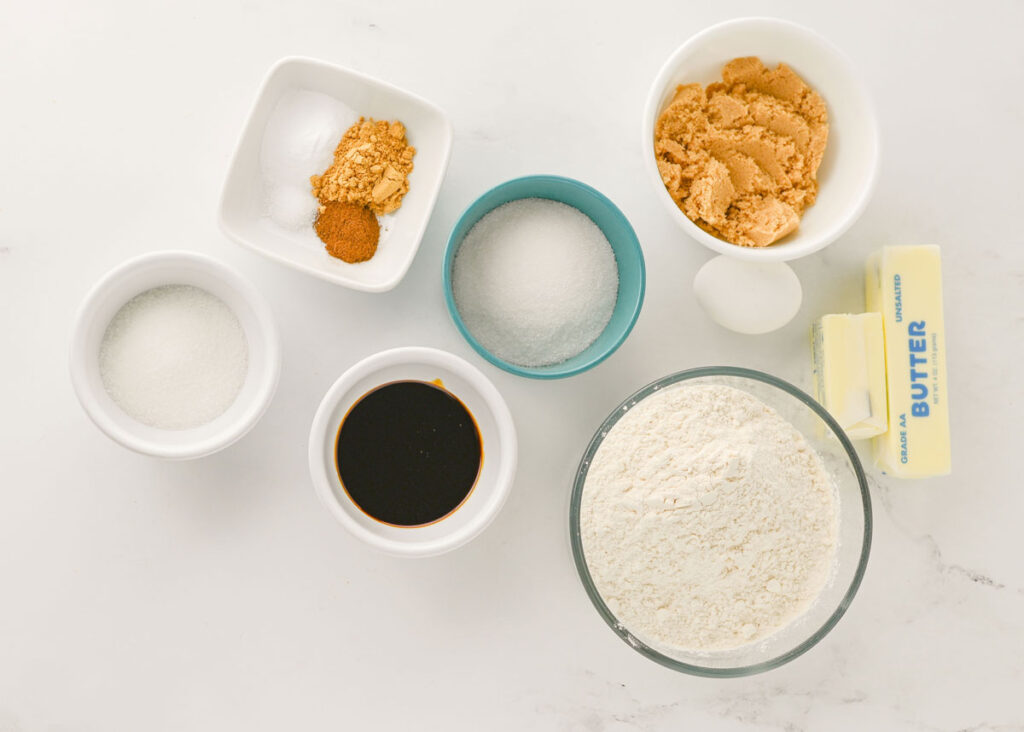 chewy ginger molasses cookie ingredients in bowls on countertop
