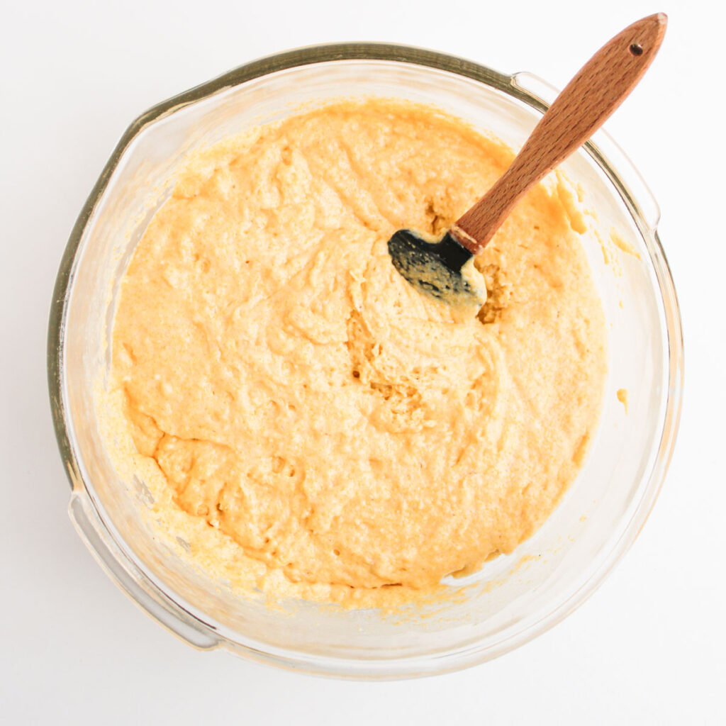 cornbread batter in bowl with spoon