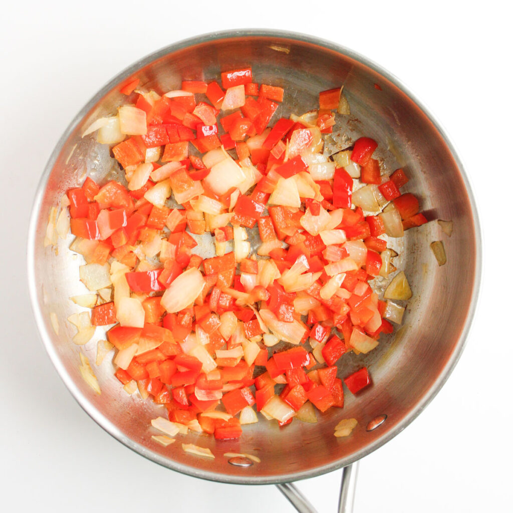 sautéed peppers and onions in pan