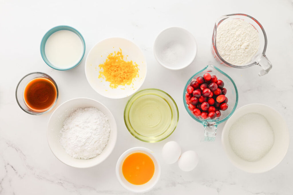 cranberry orange muffins ingredients in bowls on countertop