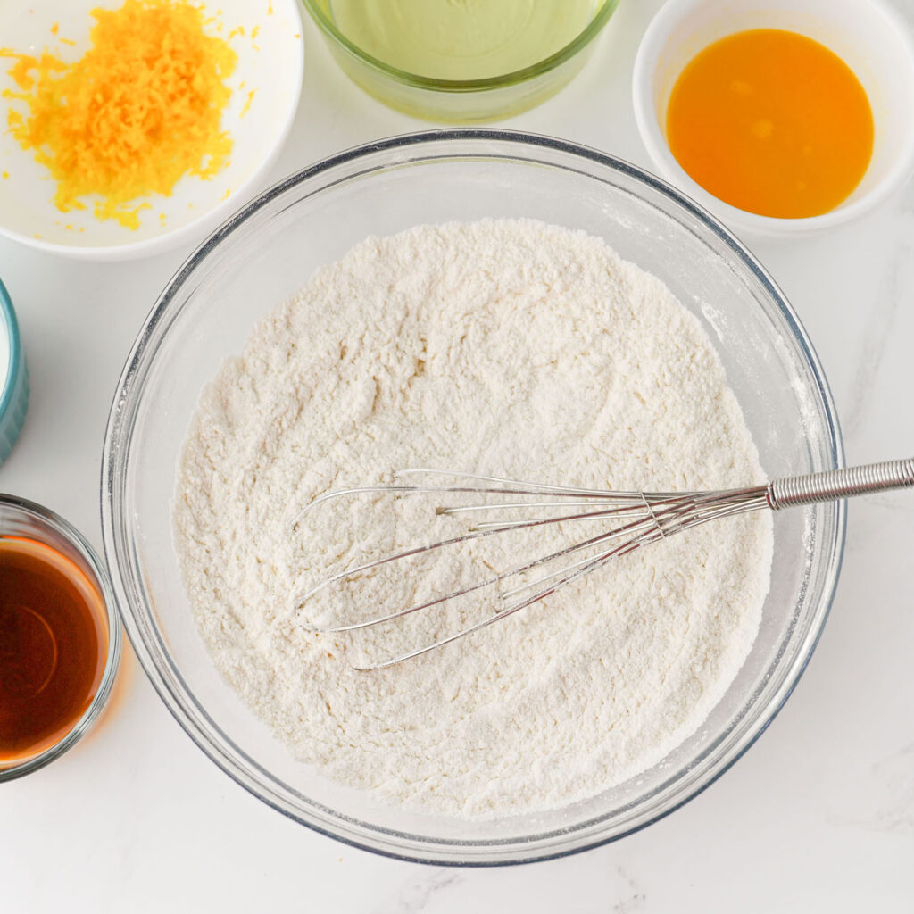 whisk in flour in glass bowl