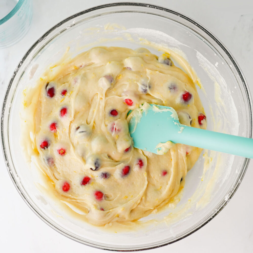 mixing cranberry orange muffin batter