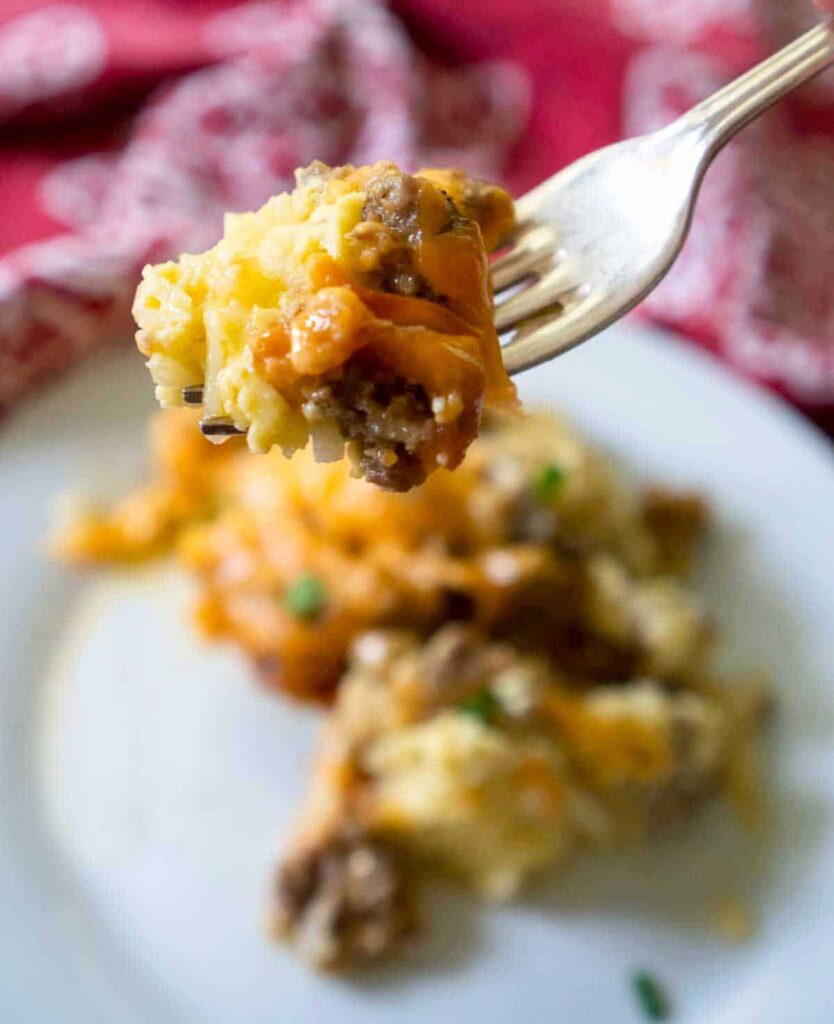 fork with bite of crock pot breakfast casserole