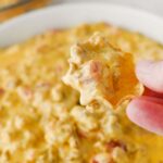 close up of chip with football dip on it and recipe name overlay