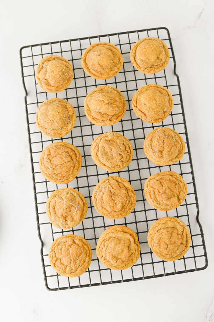 chewy ginger molasses cookies on cooling rack