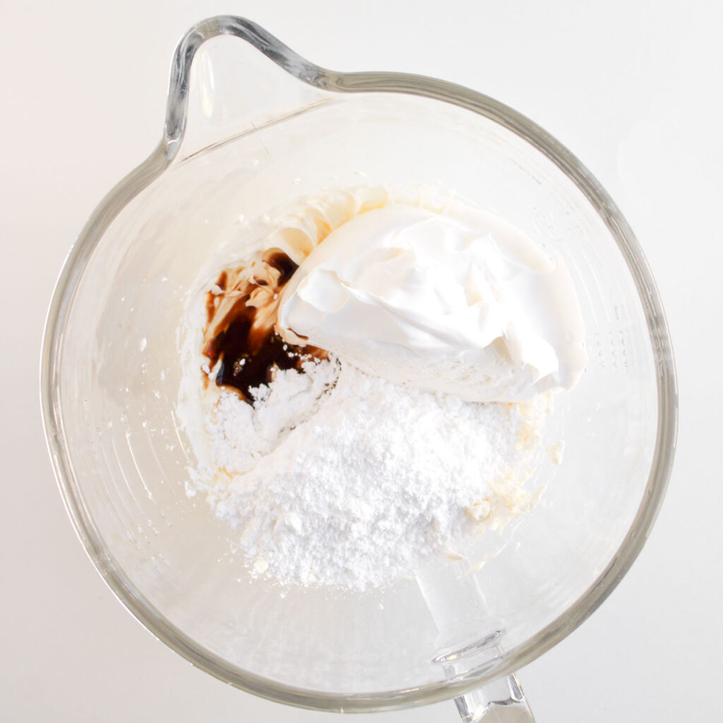 mixing apple pie dip ingredients in glass bowl