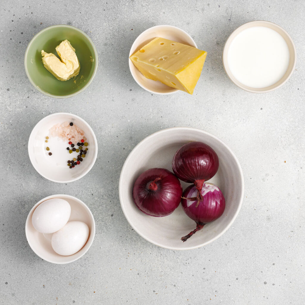 onion tart filling ingredients in bowls on counter