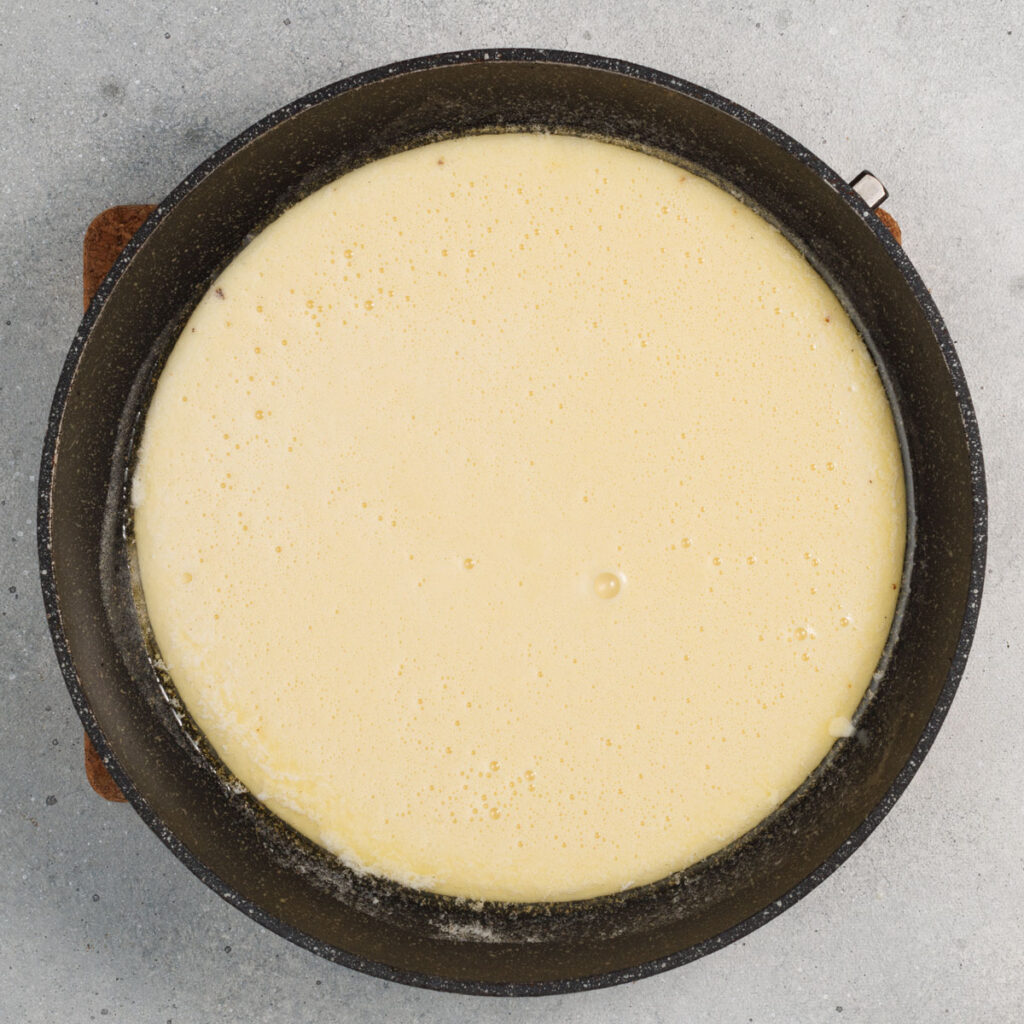 dutch baby pancake batter in skillet