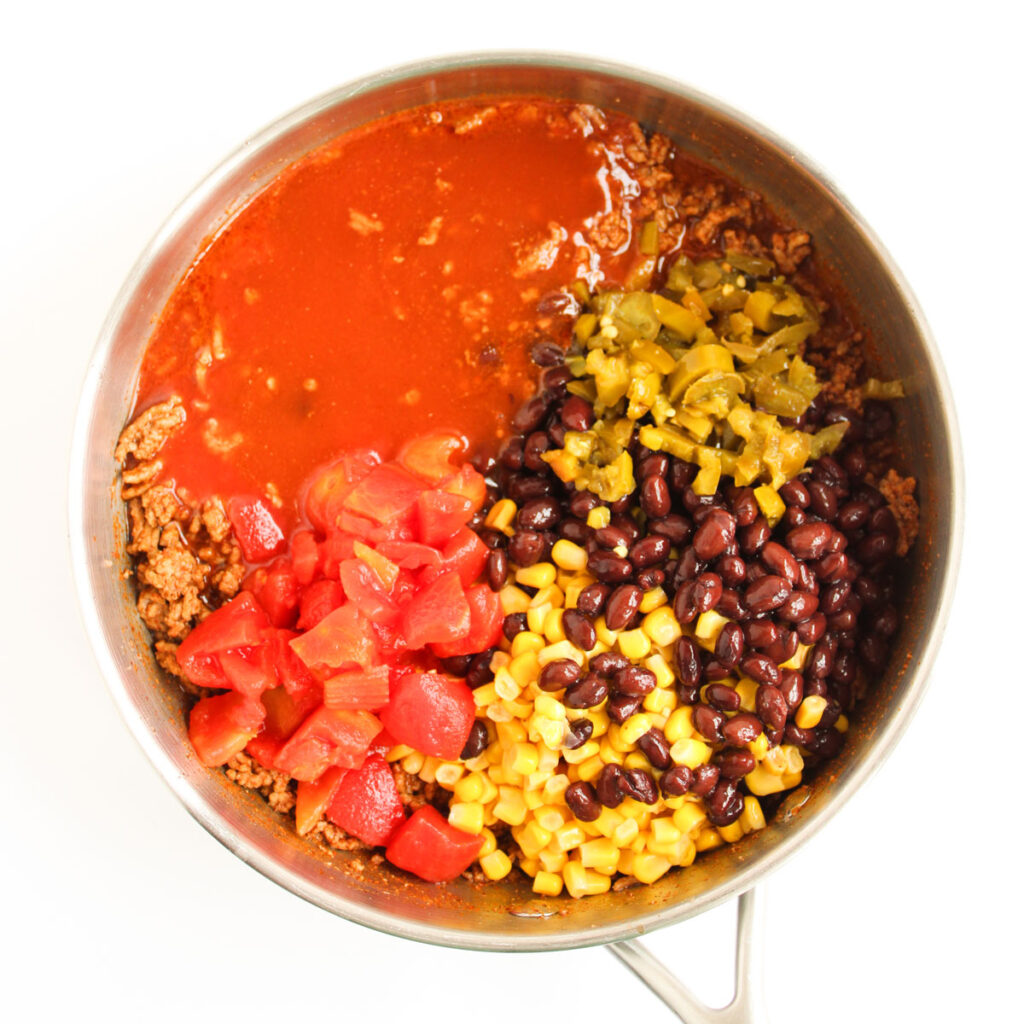 enchilada casserole ingredients in skillet