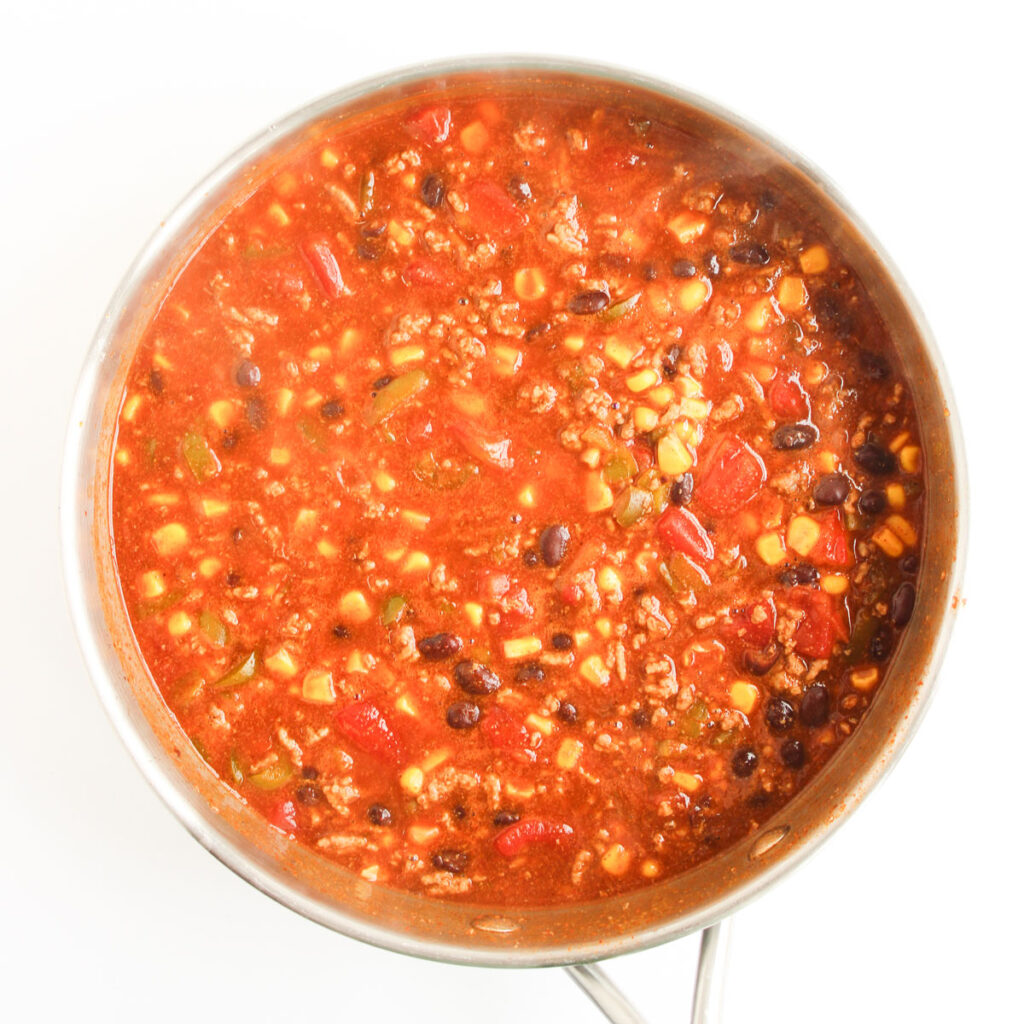 meat mixture in skillet for enchilada casserole