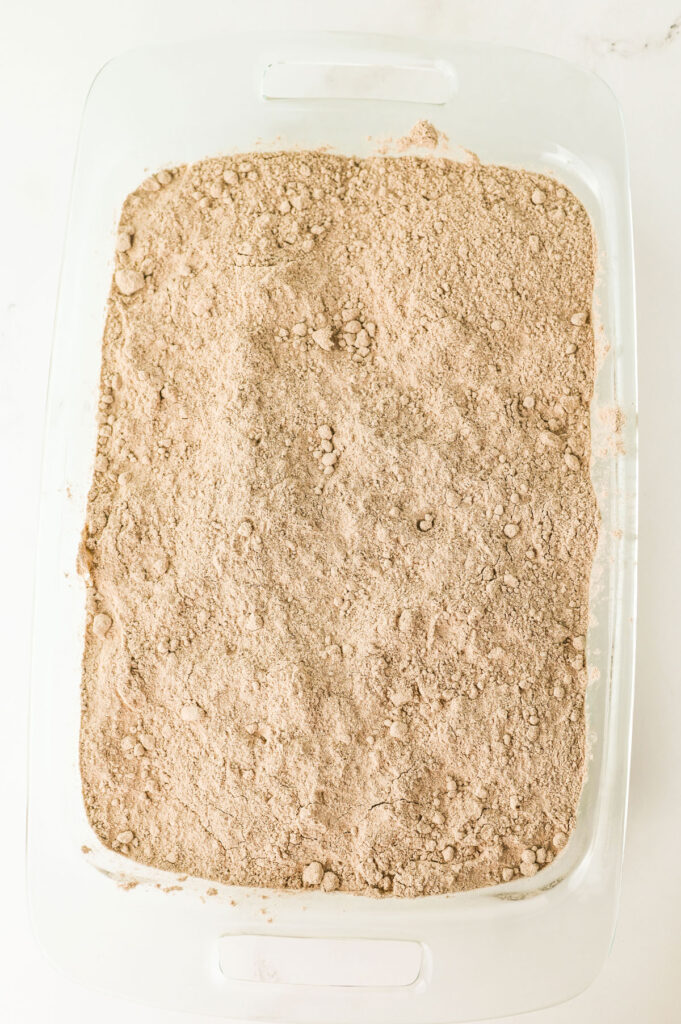 oreo dump cake before baking topped with cake mix