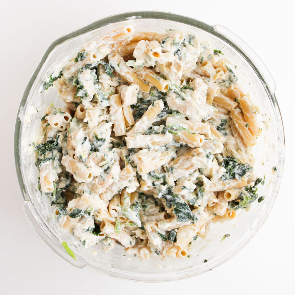 filling mixture for spinach Artichoke Chicken Casserole in glass bowl