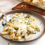 plate with serving of spinach Artichoke Chicken Casserole and fork