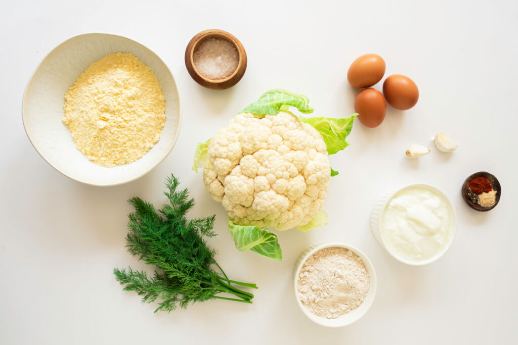 cauliflower bites ingredients in bowls on countertop