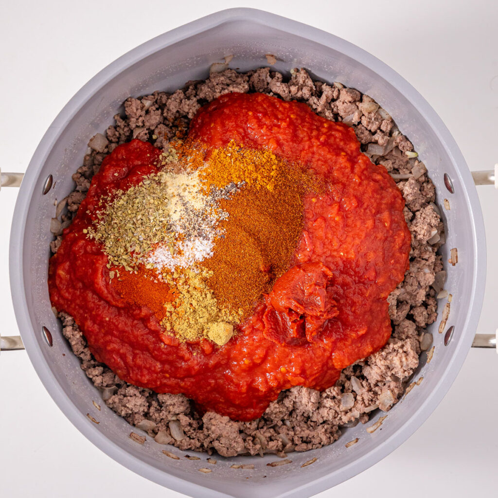 hot dog chili ingredients in pot before mixing