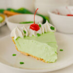 slice of shamrock shake pie on white plate