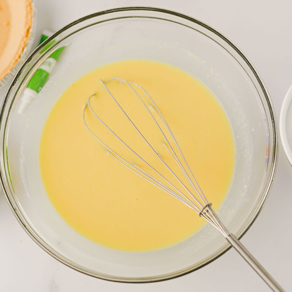 filling batter for shamrock shake pie in glass bowl