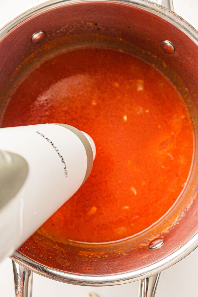 immersion blender in pot of tomato soup