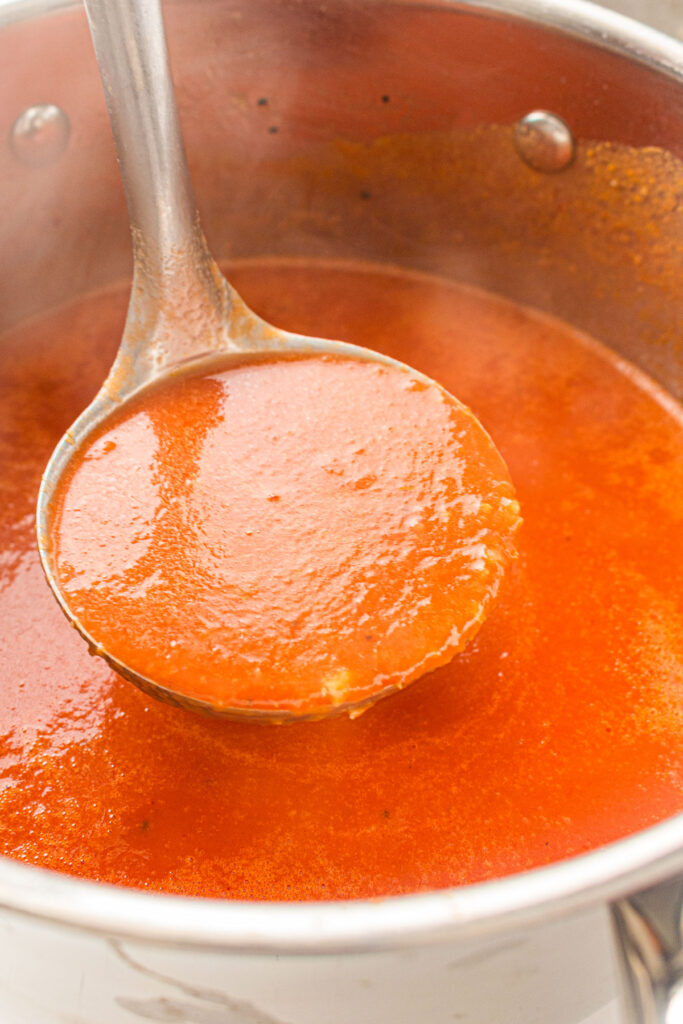 ladle full of tomato soup